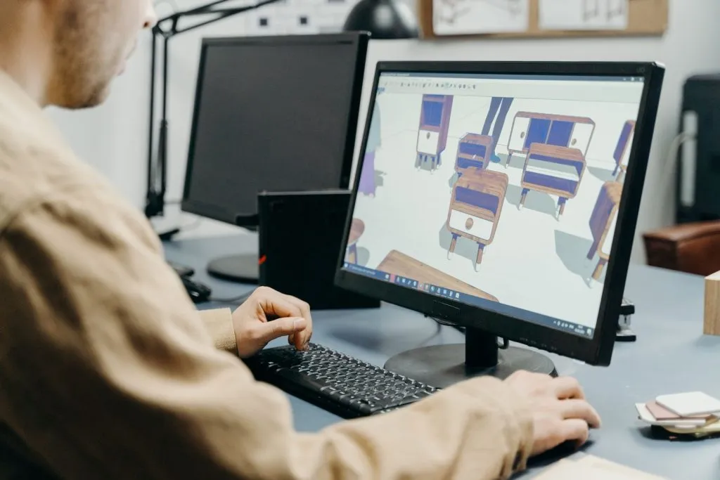 Designer utilisant un logiciel de modélisation 3D, 3DEXPERIENCE progresse de 14% au T2 2026
